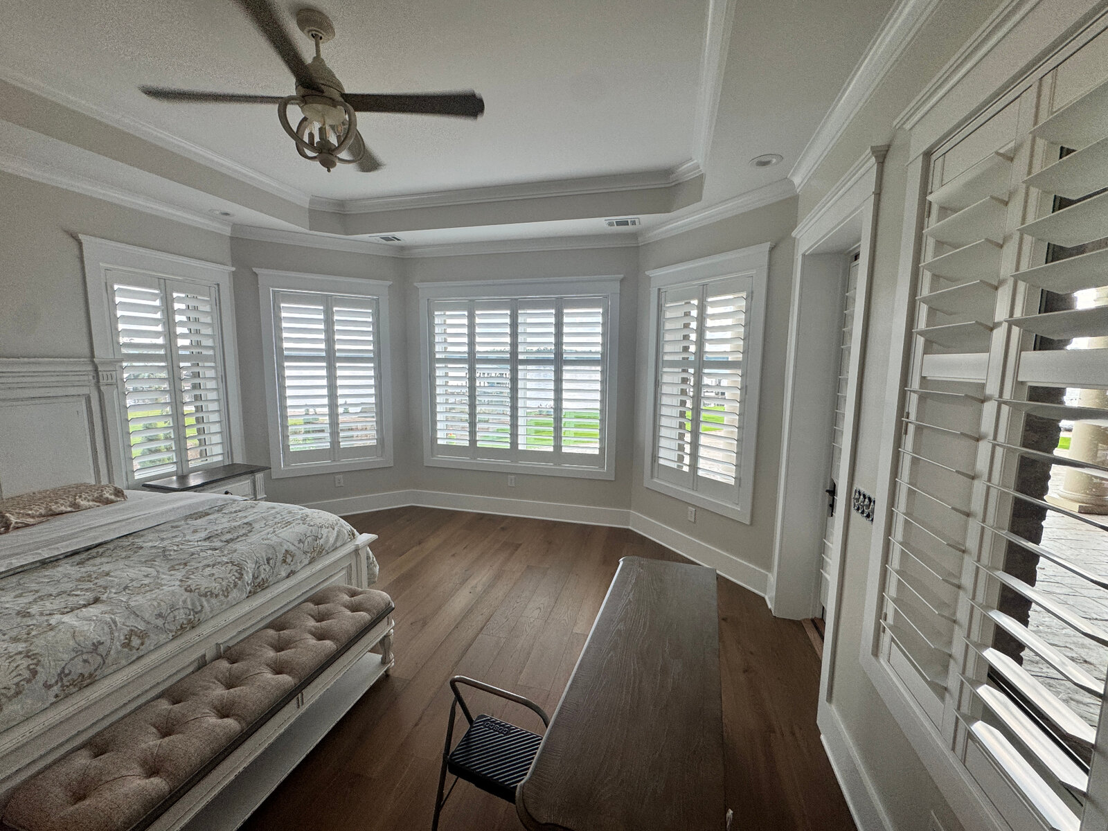 Custom sunroom with light-filtering roller shades